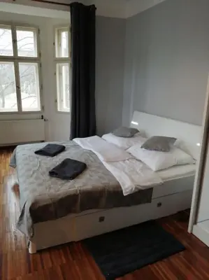 a bedroom with a bed with two towels on it at 2 Bedrooms close Vyšehrad - Congress centrum in Prague