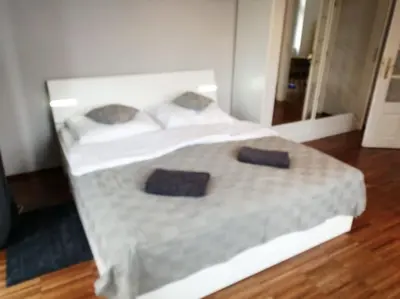 a bedroom with a bed with two pillows on it at 2 Bedrooms close Vyšehrad - Congress centrum in Prague