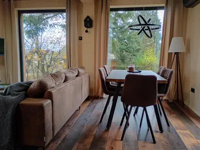 a living room with a couch and a table at Chata Budka - parties not allowed in Hradištko