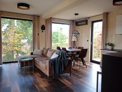a living room with a couch and a table at Chata Budka - parties not allowed in Hradištko