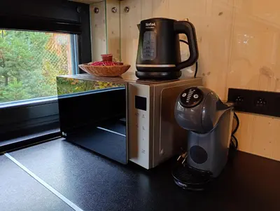 a coffee maker sitting on top of a microwave at Chata Budka - parties not allowed in Hradištko