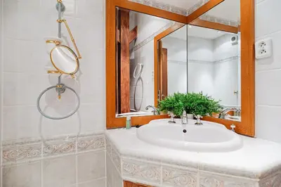 a bathroom with a sink and a mirror at U modrého orla - At the blue eagle in Prague