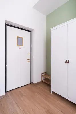 a bathroom with a white sink and red tiles at MIZU House by Prague Days in Prague