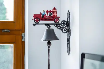 a toy train on a wall with a bell at Apartmán v Poděbradech in Poděbrady