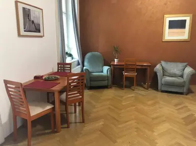 a dining room with a table and chairs at Exclusive Unique Apartment - Prague Central in Prague