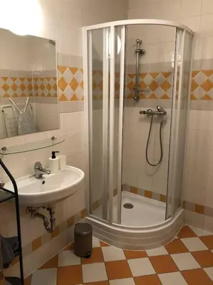 a bathroom with a shower and a sink at Exclusive Unique Apartment - Prague Central in Prague