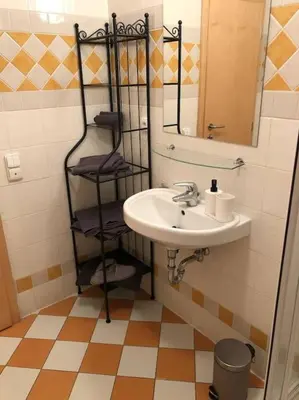 a bathroom with a sink and a mirror at Exclusive Unique Apartment - Prague Central in Prague