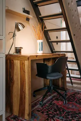 an office with a desk with a chair and a lamp at HOUSEBOAT FRED Prague in Prague