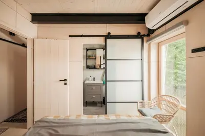 a bedroom with a bed and a window at HOUSEBOAT FRED Prague in Prague