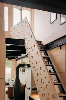 a spiral staircase in an office with a room at HOUSEBOAT FRED Prague in Prague
