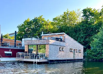 a house on a boat in the water at HOUSEBOAT FRED Prague in Prague
