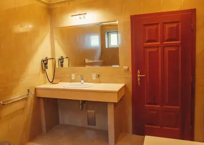 a bathroom with a sink and a mirror at hotel Memorial in Terezín