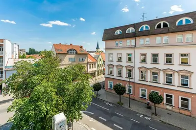 a view of a city street with buildings at Apartmán Riegrovo náměstí in Poděbrady
