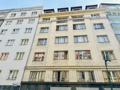 a large brick building with many windows at NiceLovely & Prague Apartment Dlouha in Prague