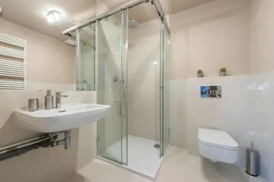 a bathroom with a shower and a sink and a toilet at Prague Spirit in Prague