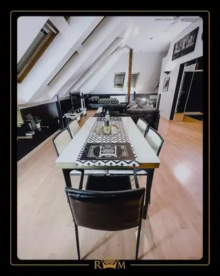 a living room with a large table and chairs at RM Luxury Apartment in Prague • 6 People • Free Parking • Pets in Prague