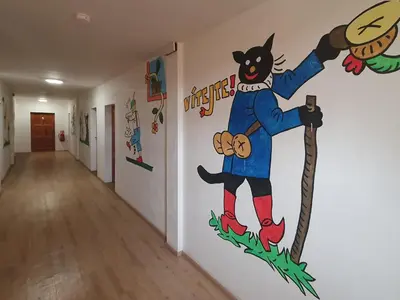 a hallway with a mural of a cat on the wall at Hrusická restaurace a penzion in Hrusice