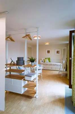 a living room with a couch and a table at Modern Apartment Charvatova in Prague