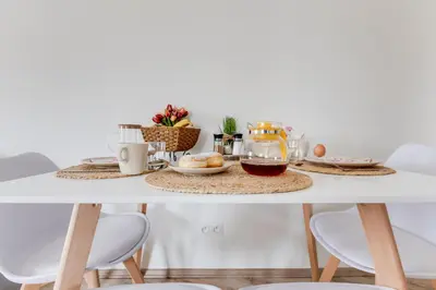 a table with food and drinks on it at Modern, bright and spacious apartment in Prague