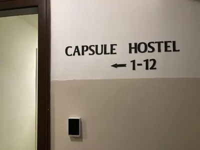 a sign on the door of a capsule hospital at Capsule hostel Žižkov tower in Prague