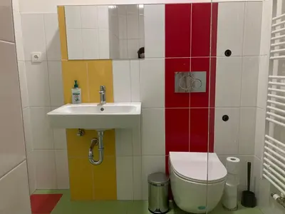 a bathroom with a sink and a toilet at Capsule hostel Žižkov tower in Prague