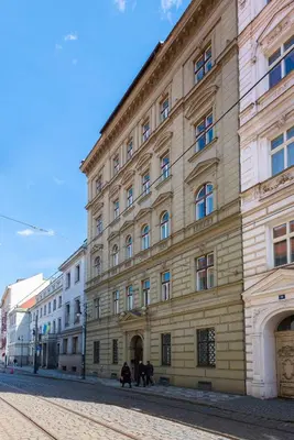 a large building on the side of a street at Vals Garden Apartment in Prague
