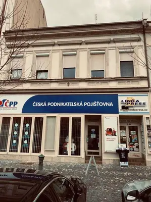 a building with a sign on the front of it at soukromý apartmán Přemysl in Nymburk