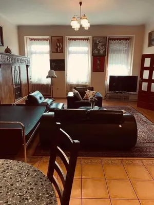 a living room with a couch and a table at soukromý apartmán Přemysl in Nymburk