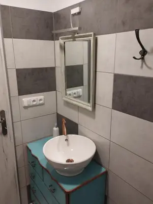 a bathroom with a sink and a mirror at Apartmány Svatá in Zdice