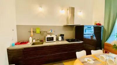 a small bedroom with a bed and a window at Hotel Apartment in Prague 2 Square in Prague