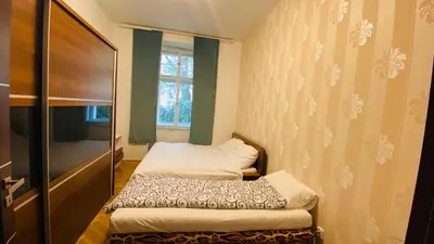 a bedroom with two beds in a room at Hotel Apartment in Prague 2 Square in Prague