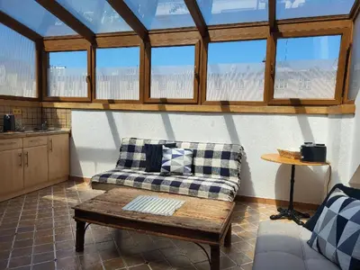a living room with a couch and a table at Sunflower Prague Apartments and suites in Prague