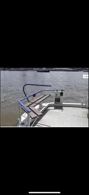 a boat with a rack on top of the water at Zouw Hausboat Zakotven -pouze ubytovaní in Roudnice nad Labem