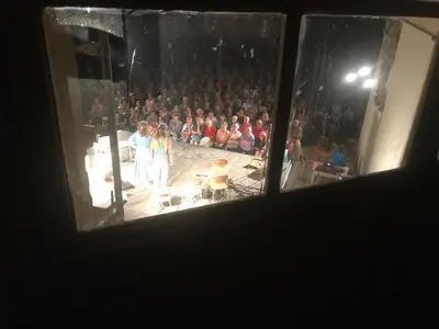 a crowd of people watching a performance in a theatre at Dvůr bude in Osečany