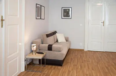 a living room with a couch and a table at Residence Krakovska 5 in Prague