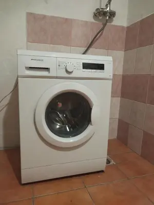 a white washing machine in a bathroom at Stará Sázava in Sázava