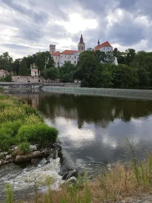 a body of water with buildings in the background at Stará Sázava in Sázava