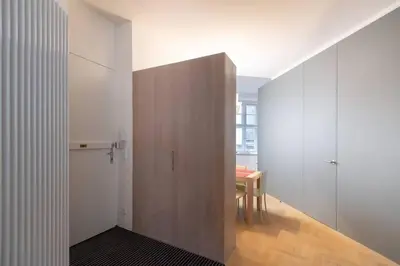 a white bathroom with a toilet and a sink at Luxury Apartment on Old Town Square in Prague
