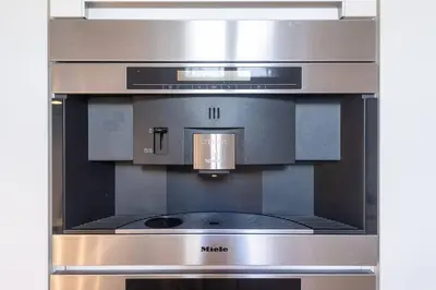 a stainless steel oven with a stove top at Luxury Apartment on Old Town Square in Prague