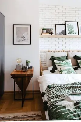 a bedroom with a bed and a table with a night stand at Loft apartment with balcony in centre in Prague