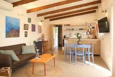 a living room with a couch and a table at Apartmán Marmeláda in Čtyřkoly