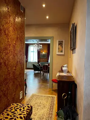 a hallway with a living room and a dining room at Le Papillon de Bohème in Prague