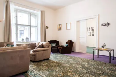 a living room with a couch and chairs and a window at Large 3 BDR APT in the heart of Prague in Prague