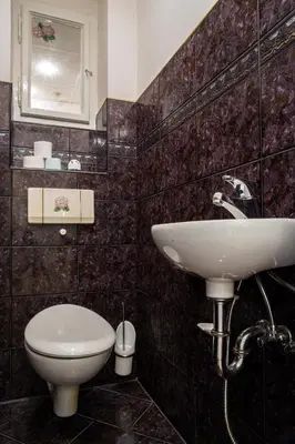 a bathroom with a sink and a toilet at Large 3 BDR APT in the heart of Prague in Prague