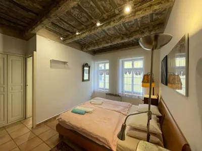 a bedroom with a bed with a lamp in it at 1 Bed Flat - Sleeps 4 - Balcony - Wifi in Prague