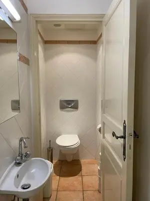 a bathroom with a white toilet and a sink at 1 Bed Flat - Sleeps 4 - Balcony - Wifi in Prague