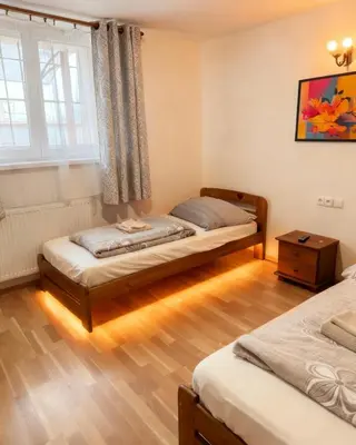 a bathroom with a shower and a toilet and a shower at Tuson Apartment in Brozany