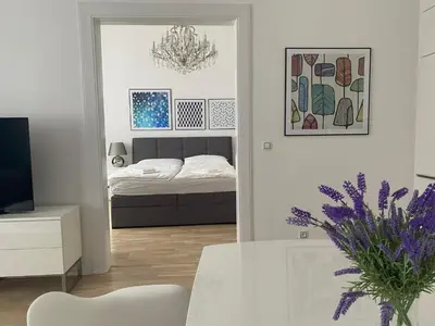 a living room with a bed and a dining room table at Top class apartment in old town 2 bedrooms in Prague