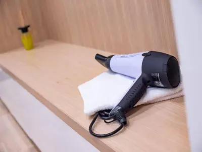 a hair dryer sitting on top of a towel at Top class apartment in old town 2 bedrooms in Prague