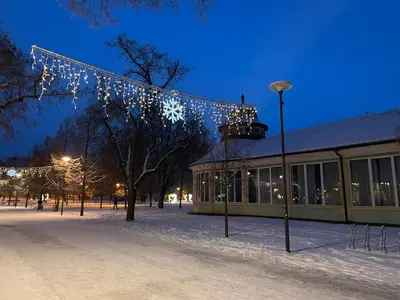 a building in the snow with christmas lights at Královské apartmá kolonáda in Poděbrady